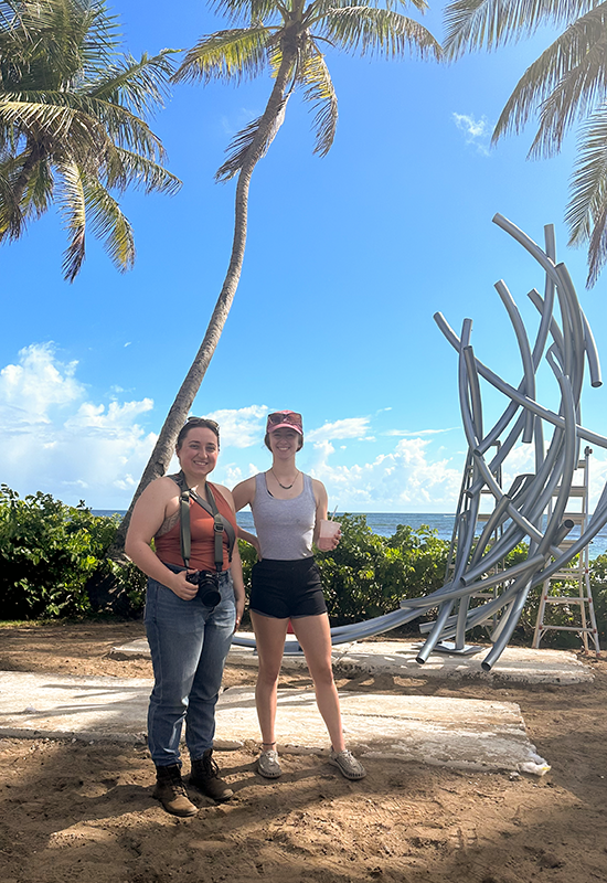 Danielle and Elizabeth take a break in front of the partially installed sculpture.
