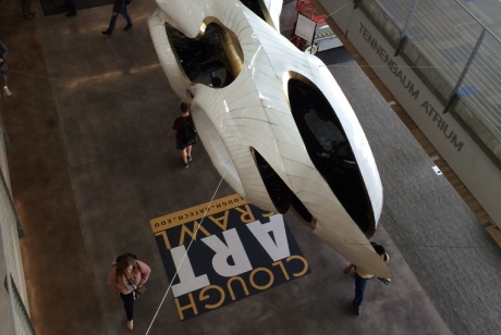 White aluminum amorphous shape with openings, suspended in the atrium of the Clough Undergraduate Learning Commons