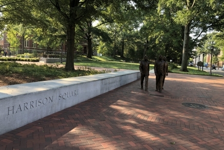 The figures of Ford Greene, Ralph Long Jr., and Lawrence Williams walking forward