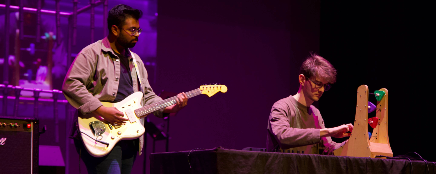 two people playing instruments with purple ambience