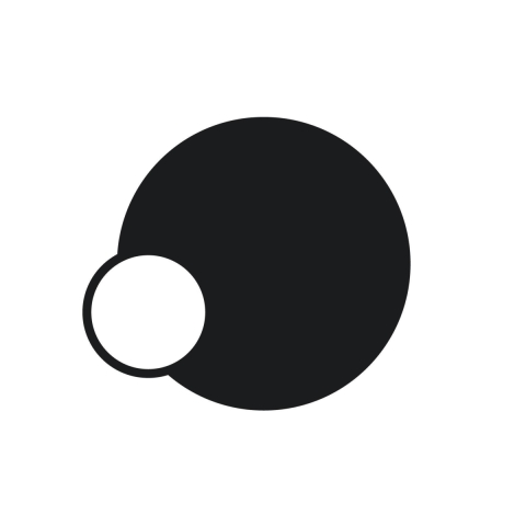 A graphic design with no text. A solid black circle, with a smaller white circle, bordered in black, partially overlapping the lower left side.