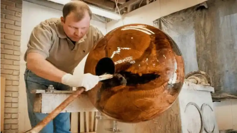 Matt Moulthrop shapes a bowl in a studio.