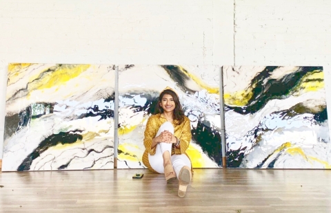 Mehwish Wasi posing in front of one of her creations.