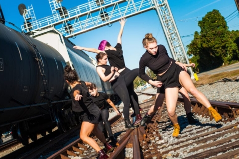 An ImmerseATL dancing on train tracks. (Photo by Synapse Photography)