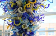 curly tendrils of glass in blues, yellows and white