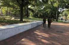 The figures of Ford Greene, Ralph Long Jr., and Lawrence Williams walking forward