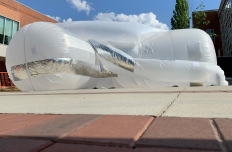 A giant inflatable structure in white and silver sits on the Arts Plaza. By Georgia Tech assistant professor Noura Howell.