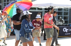 People dancing while wearing headphones. Silent Disco with DJ 2-Smooth