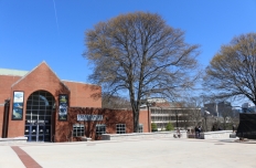 The exterior of the Ferst Center for the Arts, with the Arts Plaza in the foreground of the arched front entrance