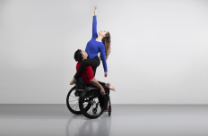  Full Radius Dance dancers, Juliana and Peter together in a  photography studio photoshoot representing physically integrated dance.