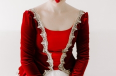 Dancer wearing red and burgundy outfit