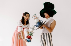 dancers dresses in alice in wonderland themed attire