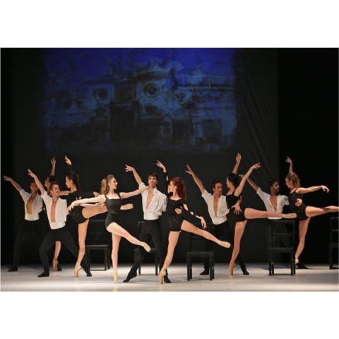 A ballet company on stage. 5 couples, the men in white blousons and black tights, the women in black tank tops and shorts.